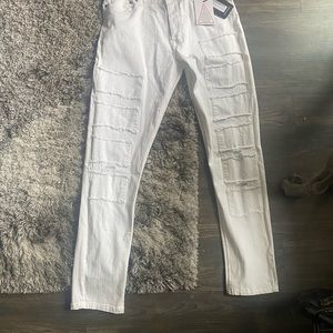 Brand new w tags white stretch and very comfortable skinny pants with patchwork.